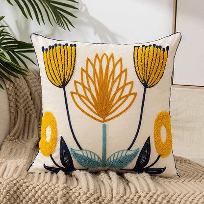 Vintage floral embroidered Lotus Flower pillowcase styled on a sofa, boho throw cushion cover adds texture and charm to bohemian home decor, perfect for cozy living room decor, eclectic home styling, and unique boho gifts under $50
