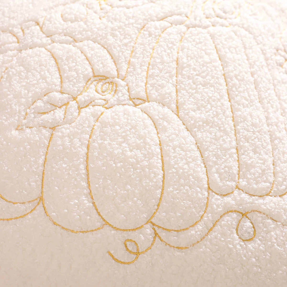 Embroidered design of a pumpkin on a textured beige fabric background. fall boho pillow throw gift ideas