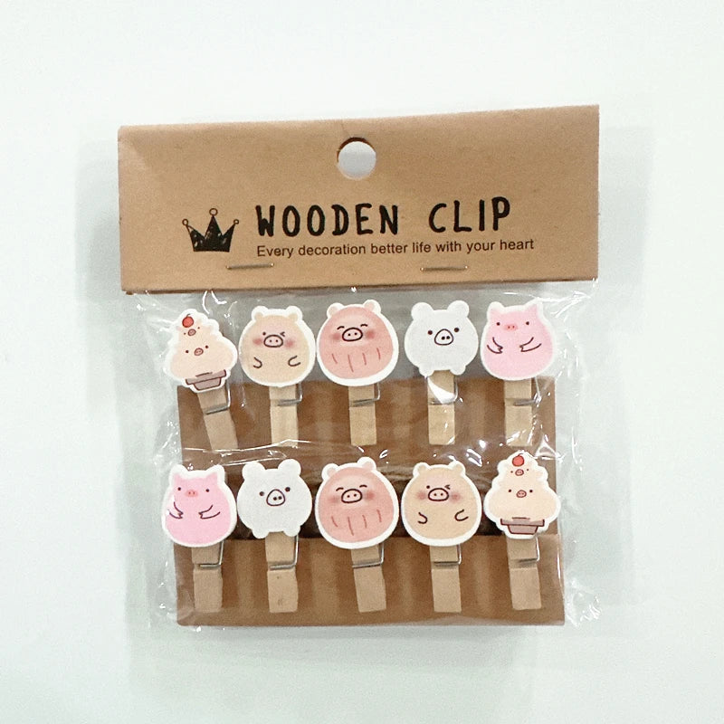 Packaged wooden clips with animal designs on a white background