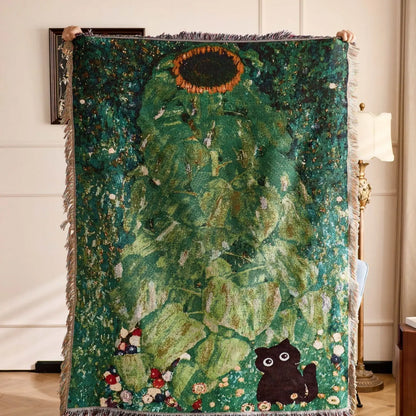Decorative rug with green leaves and a black cat design held by two people. Cat woven throw blanket for boho sofa and home decor