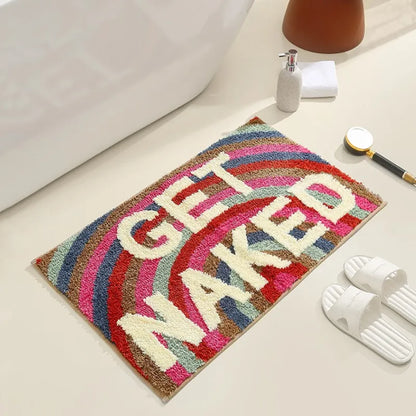 Colorful bath mat with 'GET NAKED' text on a bathroom floor. boho home decor, bathroom rug, tufted bath mat, Get Naked rug, colorful shower mat, apartment decor, dorm bathroom accessories, housewarming gift, microfiber bath mat, fun bathroom rug, American style bath mat