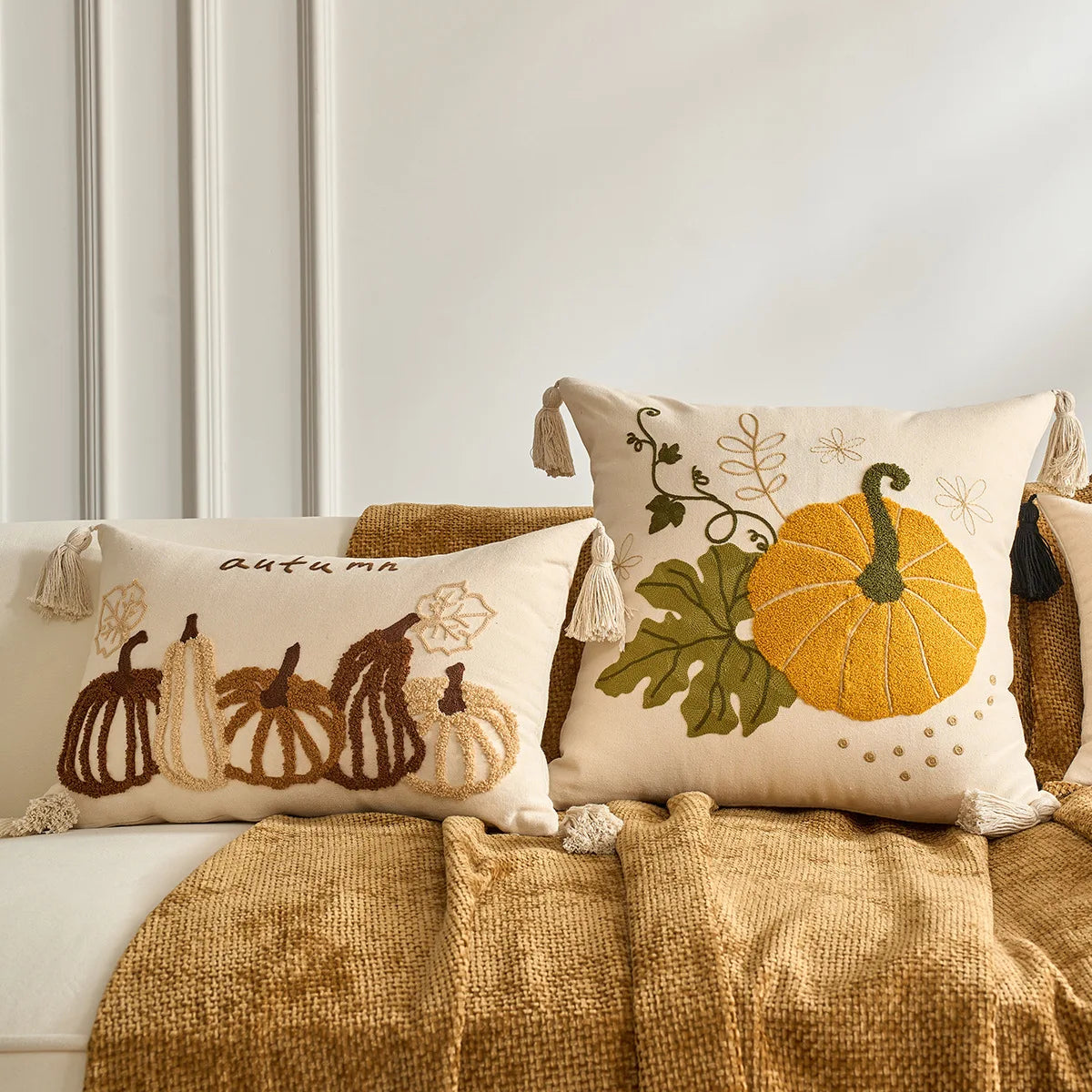 Decorative pillows with pumpkin designs on a couch. Halloween and Thanksgiving decorative pillow cover For Fall
