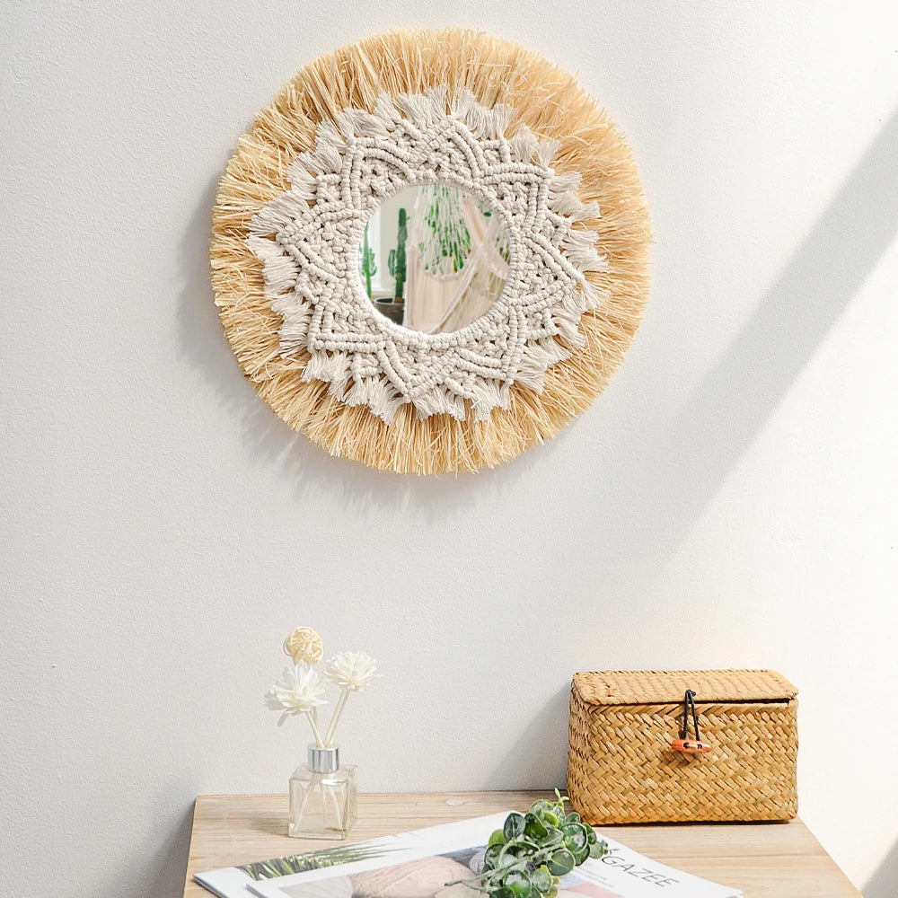 Round woven mirror with decorative elements on a wall above a wooden surface. boho home decor, boho wall mirror, macrame wall mirror, nordic decor, romantic wedding wall decoration, housewarming gift, round straw mirror, woven wall decor, tapestry mirror, boho bedroom wall accent, rustic mirror wall hanging