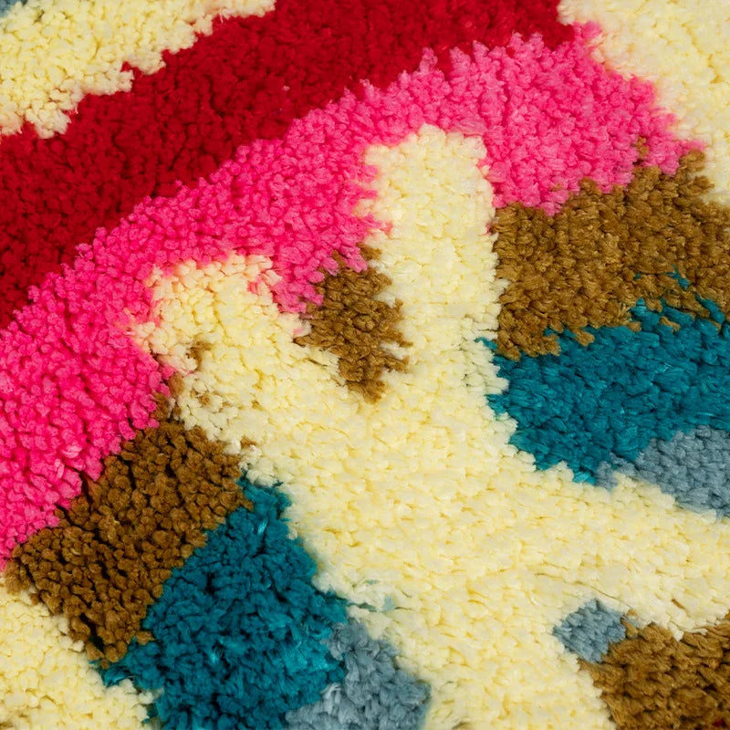 Close-up of a colorful textured surface with pink, red, blue, and brown patterns. boho home decor, bathroom rug, tufted bath mat, Get Naked rug, colorful shower mat, apartment decor, dorm bathroom accessories, housewarming gift, microfiber bath mat, fun bathroom rug, American style bath mat