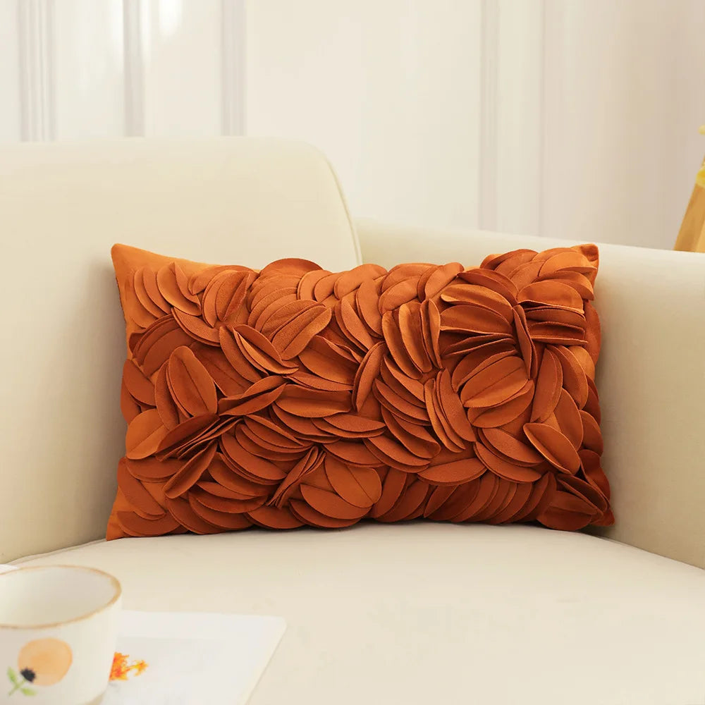Orange decorative pillow on a beige sofa with a neutral background. Handmade patchwork floral pillowcase for bed or living room