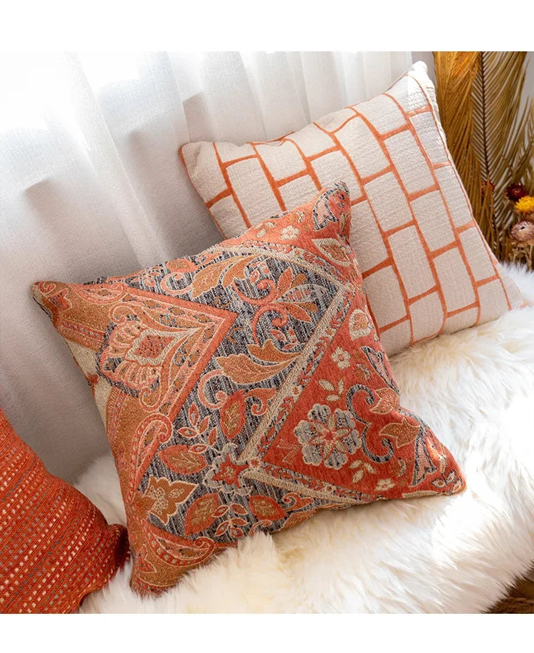 Decorative pillows on a white surface with a patterned design