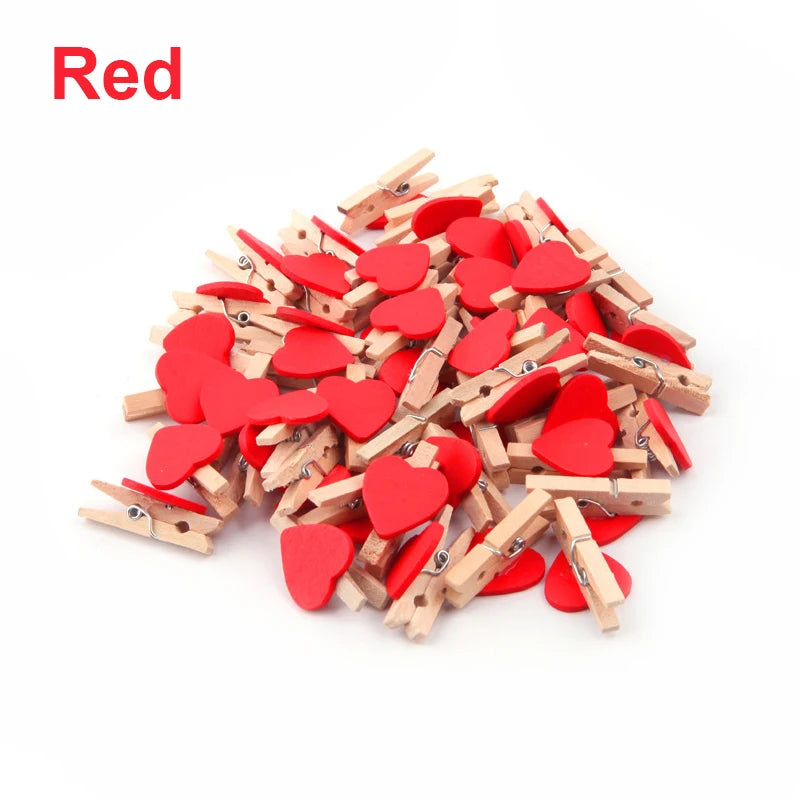 Red heart-shaped wooden clips on a white background