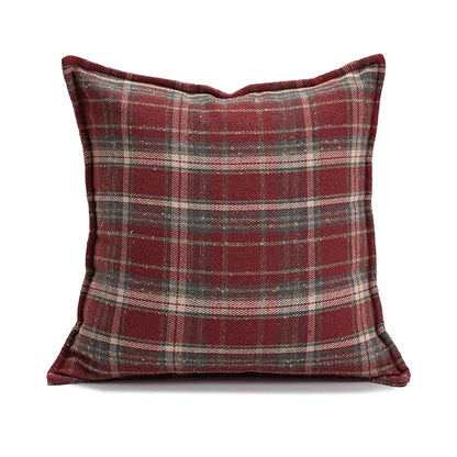 Plaid pillow with red and gray pattern on a white background