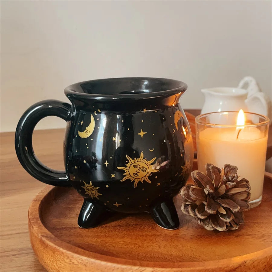 Black mug with celestial design on a wooden tray with a candle and pine cone. boho home decor, witch coffee mug, ceramic cauldron cup, black witch mug, Halloween kitchen decor, spooky housewarming gift, gothic home, potion mug, witchy drinkware, holiday mug for her, cozy boho kitchen accessories