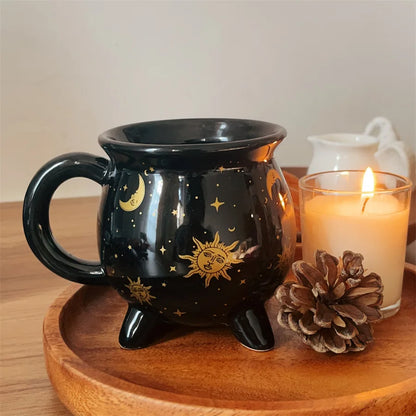 Black mug with celestial design on a wooden tray with a candle and pine cone. boho home decor, witch coffee mug, ceramic cauldron cup, black witch mug, Halloween kitchen decor, spooky housewarming gift, gothic home, potion mug, witchy drinkware, holiday mug for her, cozy boho kitchen accessories