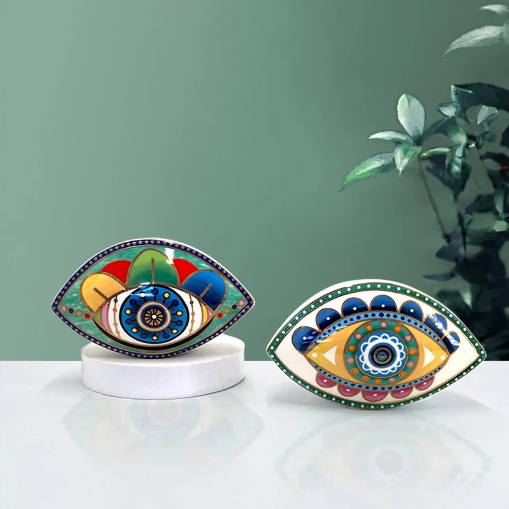 Two Moroccan Turkish blue evil eye ceramic figurines on display, unique bohemian home decor accent perfect for eclectic and boho home styles, adds soulful vibes and a cozy touch to any room, great for gifting as a boho home decor gift or housewarming present