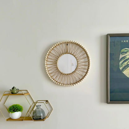 Decorative wall mirror with a geometric shelf and framed artwork on a light gray wall. Hand-woven Nordic round decorative mirror with Lafite grass frame and hemp rope, boho wall hanging for living room, entryway, or bedroom decor