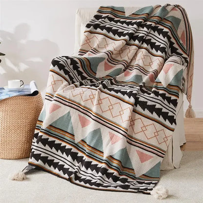Bohemian Patterned blanket draped over a chair in a room with a woven basket.