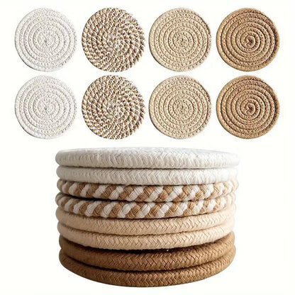 Set of round woven coasters in various colors stacked and arranged on a white background. Stacked cotton coasters in cozy prairie chic style – boho-inspired drink mats
