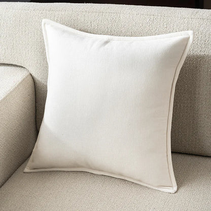 Beige pillow on a beige sofa