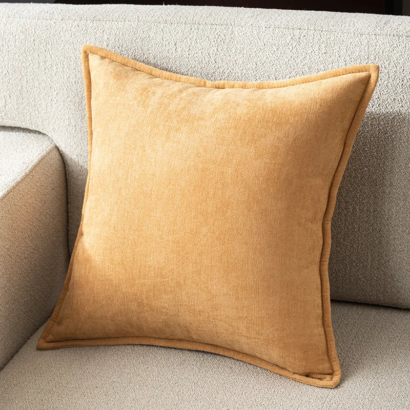 Brown pillow on a beige sofa