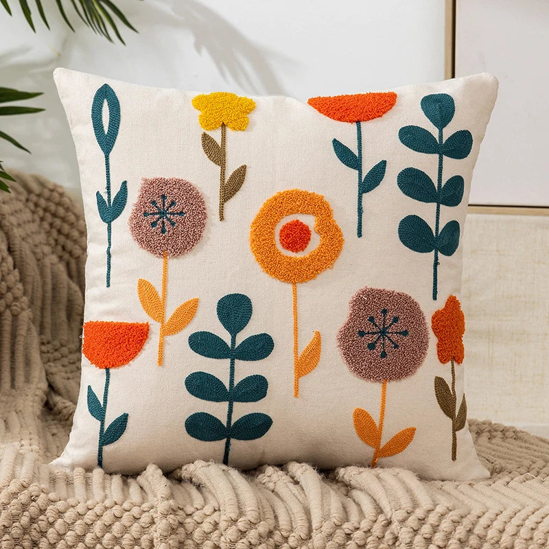 Vintage floral embroidered pillowcase styled on a sofa, boho throw cushion cover adds texture and charm to bohemian home decor, perfect for cozy living room decor, eclectic home styling, and unique boho gifts under $50