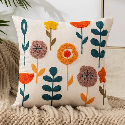 Vintage floral embroidered pillowcase styled on a sofa, boho throw cushion cover adds texture and charm to bohemian home decor, perfect for cozy living room decor, eclectic home styling, and unique boho gifts under $50