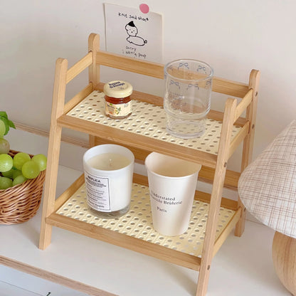 Wooden shelf with decorative items on a white surface 2-tier bamboo countertop organizer shelf in walnut and blonde finish, multipurpose coffee cup holder and storage rack for kitchen, bathroom, or vanity