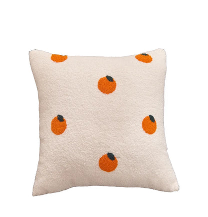 Decorative pillow with orange and black patterns on a white background