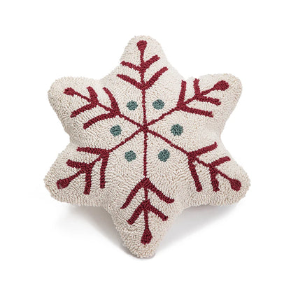 Decorative snowflake pillow with red and green patterns on a white background