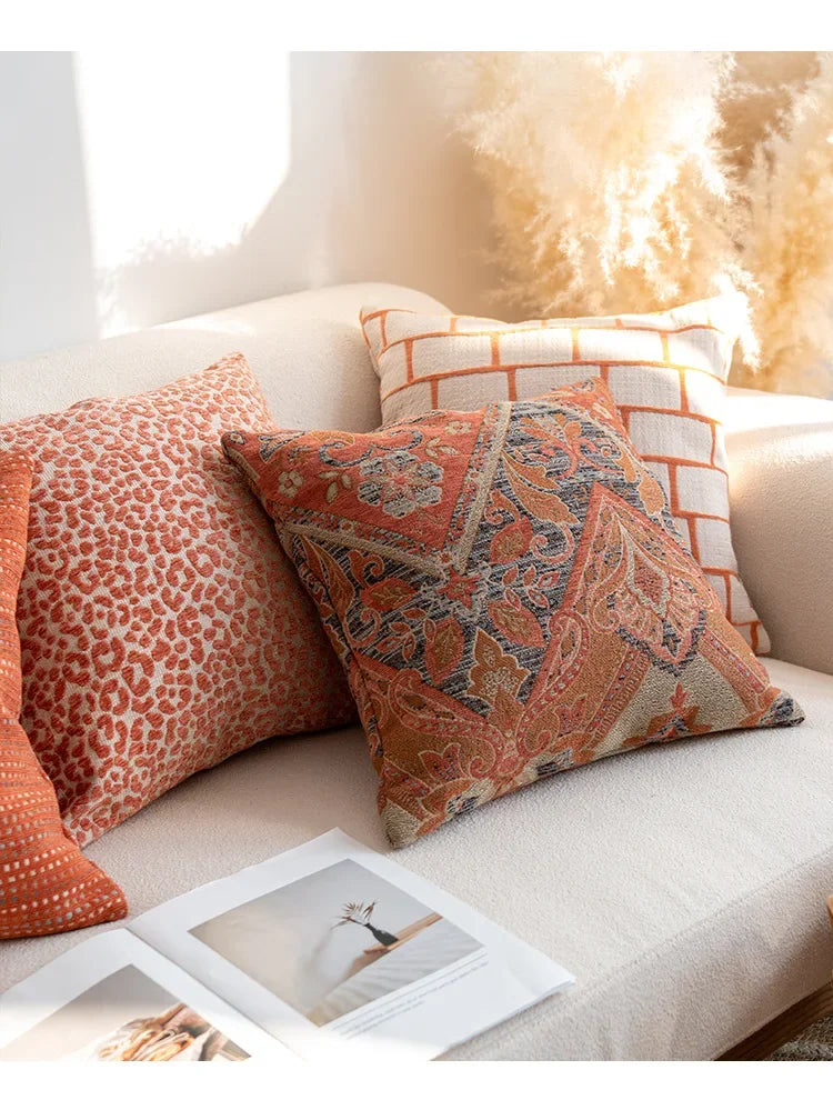 Decorative pillows on a sofa with a warm, cozy atmosphere