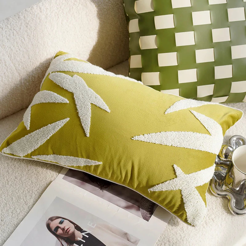 Green pillow with white leaf pattern on a couch next to a magazine and coffee cup boho home decor, housewarming gift, embroidered pillow cover, flying bird cushion, animal pattern pillowcase, decorative throw pillow, Nordic cushion cover, luxury boho accent, sofa decor, nature-inspired pillow, canvas cushion case, textured home accessories