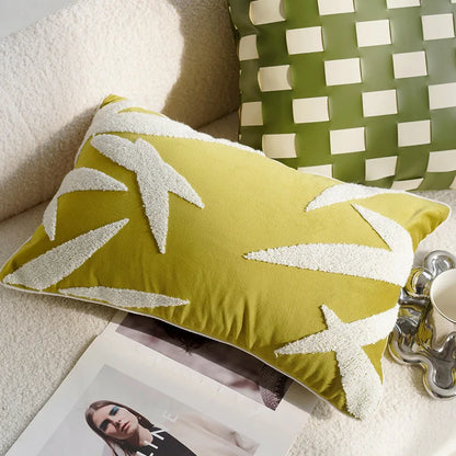 Green pillow with white leaf pattern on a couch next to a magazine and coffee cup boho home decor, housewarming gift, embroidered pillow cover, flying bird cushion, animal pattern pillowcase, decorative throw pillow, Nordic cushion cover, luxury boho accent, sofa decor, nature-inspired pillow, canvas cushion case, textured home accessories
