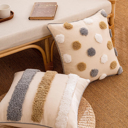 Two decorative pillows on a textured surface with a wicker chair and books in the background. Boho cushion cover for sofa, bed, or chair 18x18 inch

