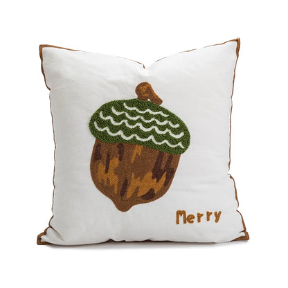 Decorative pillow with an acorn design and 'Merry' text on a white background