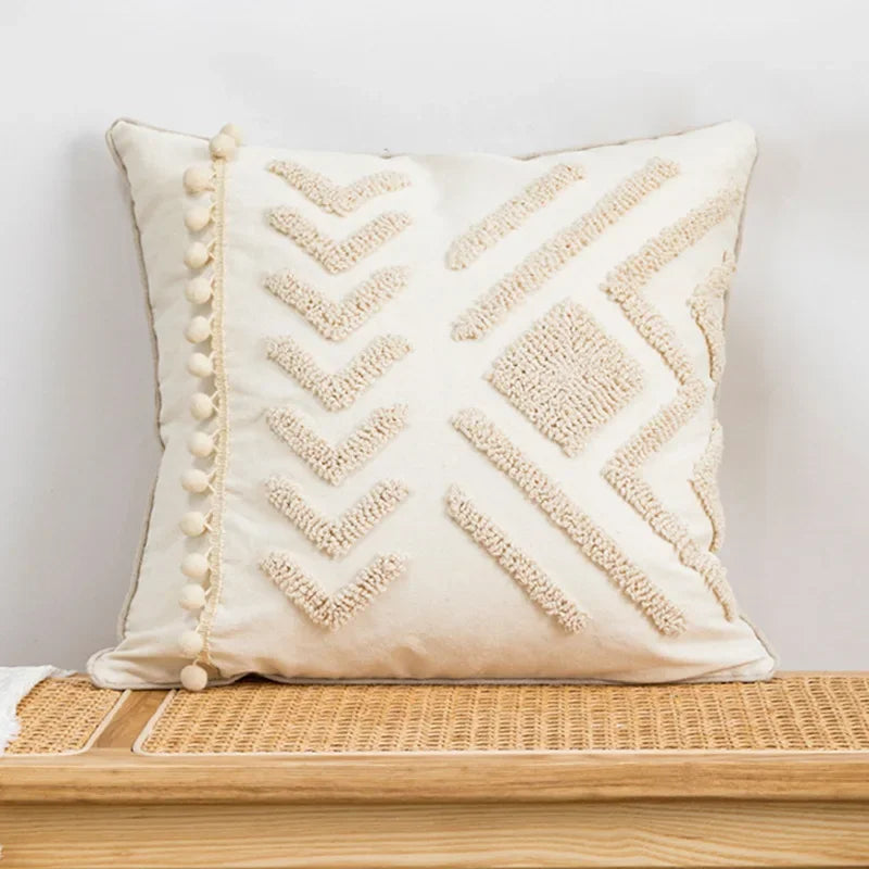 Decorative pillow with geometric pattern on a wooden surface against a light background Nordic blue tufted cushion cover with geometric stripe and grid crochet pattern, tassel pillow cover for sofa, bed, and boho home decor