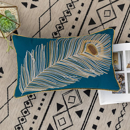Decorative pillow with peacock feather design on a patterned rug. Bohemian embroidered throw pillow cover with geometric design, cotton-blend cushion for sofa, bed, or modern home decor.