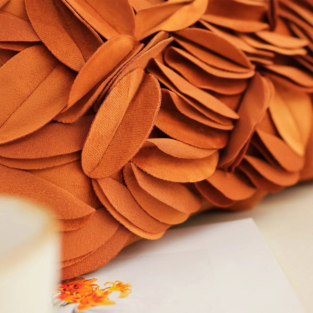 Close-up of a textured orange fabric with a blurred background. Handmade patchwork floral pillowcase for bed or living room