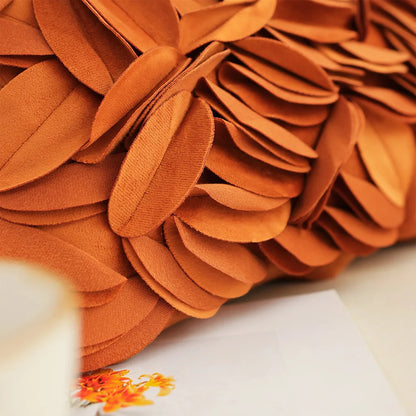 Close-up of a textured orange fabric with a blurred background. Handmade patchwork floral pillowcase for bed or living room