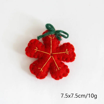 Red felt flower with green stem on a white background