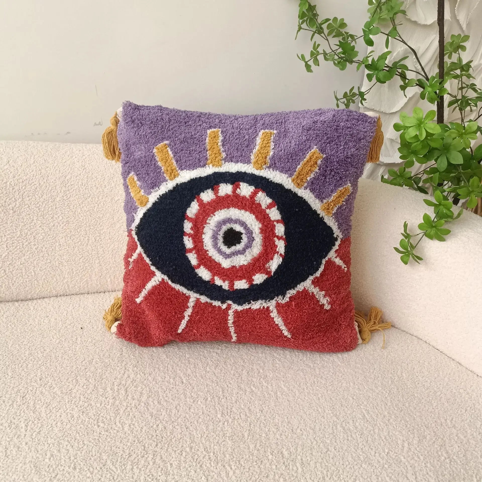 Decorative pillow with eye design on a couch Boho Devil's Eye embroidered pillow cover with tufted geometric design in cotton blend fabric, decorative cushion for sofa, bed, or living room boho home decor.