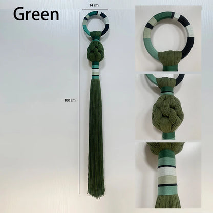Green decorative item with tassel and measurement details on a white background. boho macrame wall art