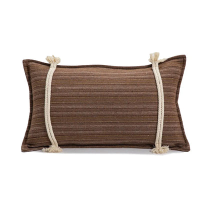 Brown pillow with white rope accents on a white background