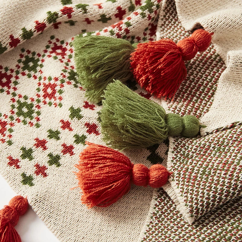 Decorative tassels on a patterned fabric background