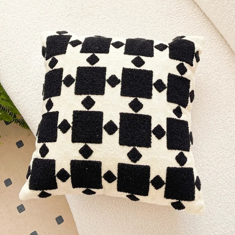 Decorative pillow with black geometric pattern on a light background. Bohemian embroidered throw pillow cover 18x18 inch with geometric towel embroidery, decorative cushion for sofa, bed, or living room boho home decor