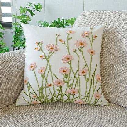 Floral-patterned pillow on a beige couch with plants in the background. Floral embroidered throw pillow cover boho decor