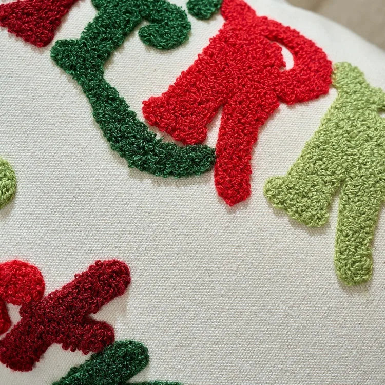 Close-up of a textured surface with red and green shapes resembling letters or abstract forms.