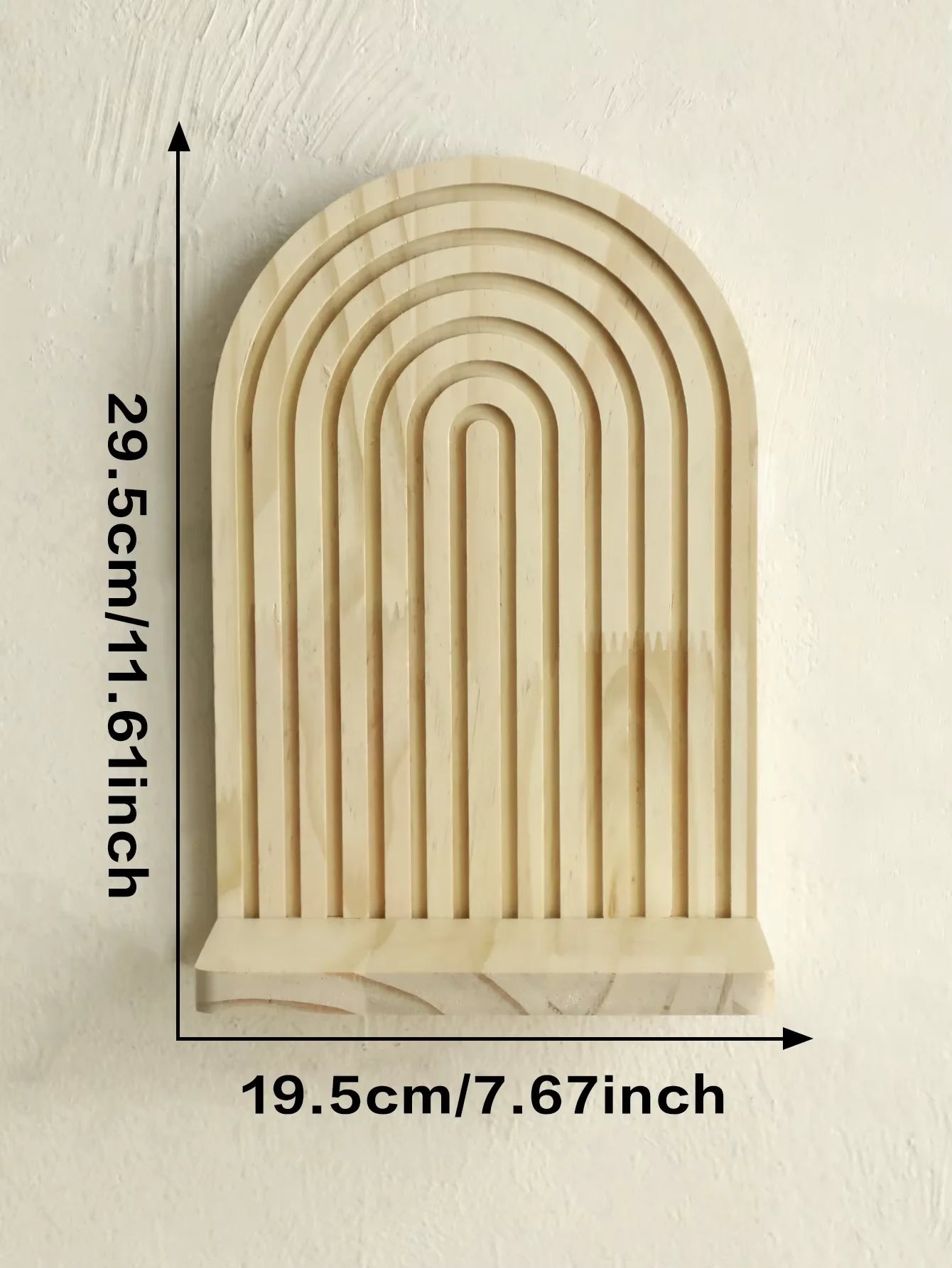Wooden arch-shaped shelf with measurements on a light background