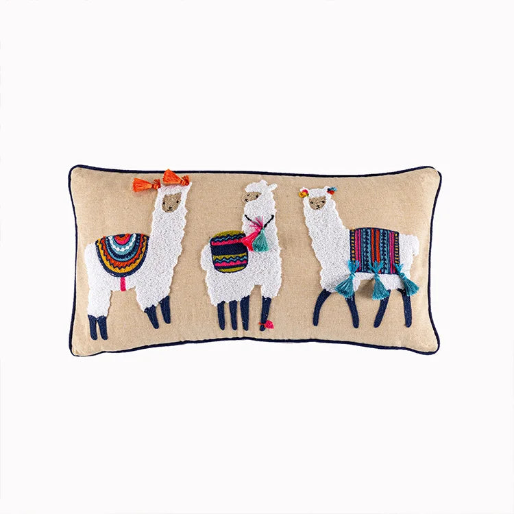 Decorative pillow with embroidered llamas on a beige background. Bohemian embroidered throw pillow cover with geometric design, cotton-blend cushion for sofa, bed, or modern home decor.