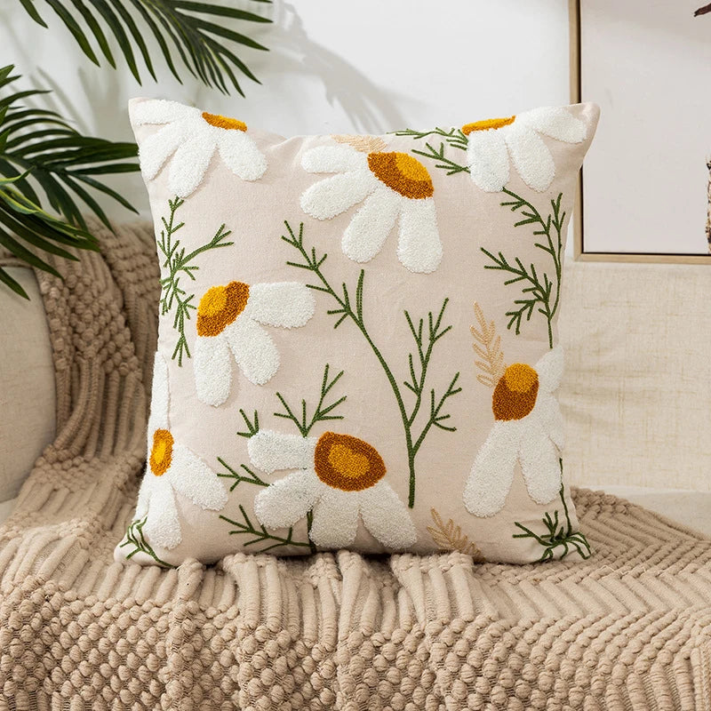 Vintage floral embroidered Daisies pillowcase styled on a sofa, boho throw cushion cover adds texture and charm to bohemian home decor, perfect for cozy living room decor, eclectic home styling, and unique boho gifts under $50