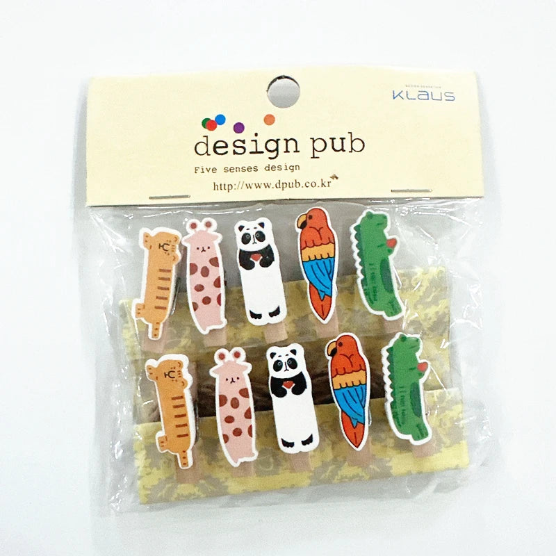 Packaged colorful animal-shaped clips with 'Klaus' branding on a white background