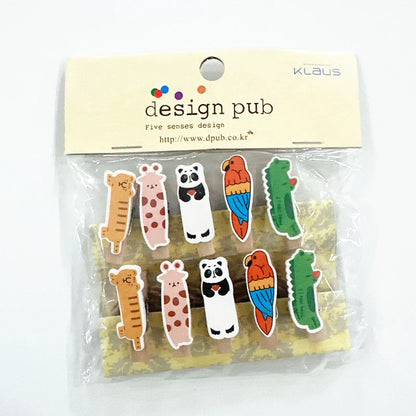Packaged colorful animal-shaped clips with 'Klaus' branding on a white background