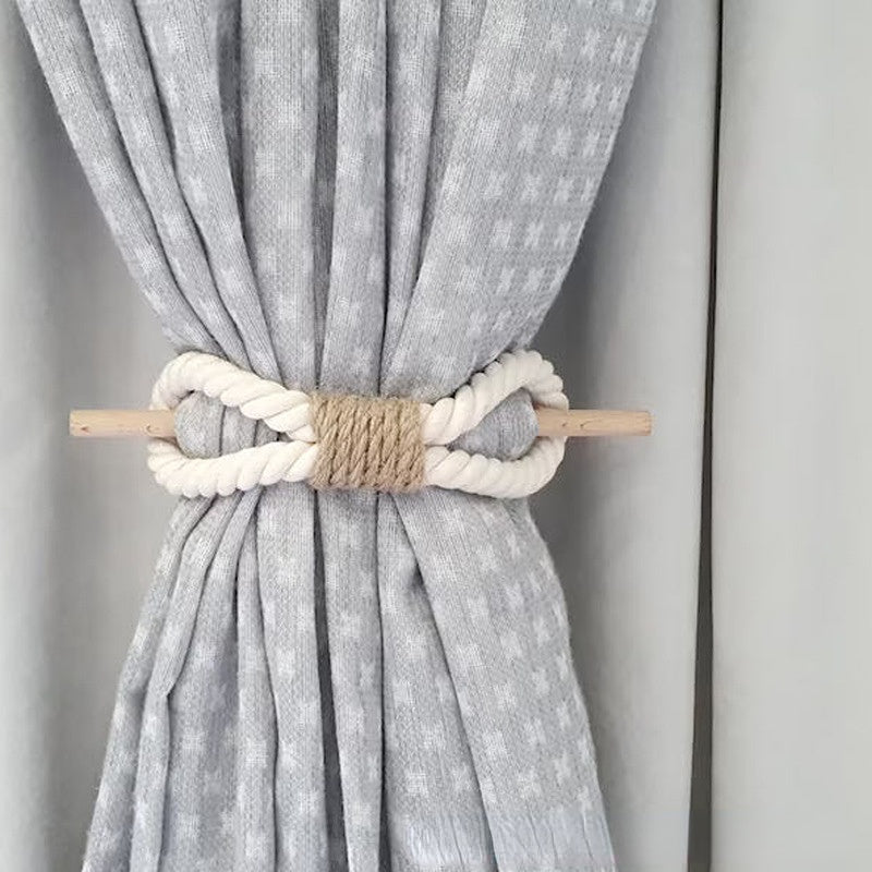 Gray curtain with a decorative rope and wooden clip on a plain background boho home decor, curtain tie back, wooden curtain buckle, nordic home accessory, hemp rope curtain tie, rustic window decor, boho curtain accessory, modern farmhouse, minimalist curtain hold, housewarming gift idea