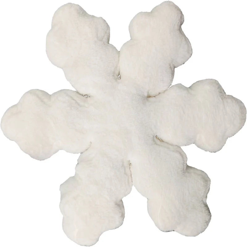 A fluffy snowflake-shaped white faux fur rug or cushion on a plain white background.