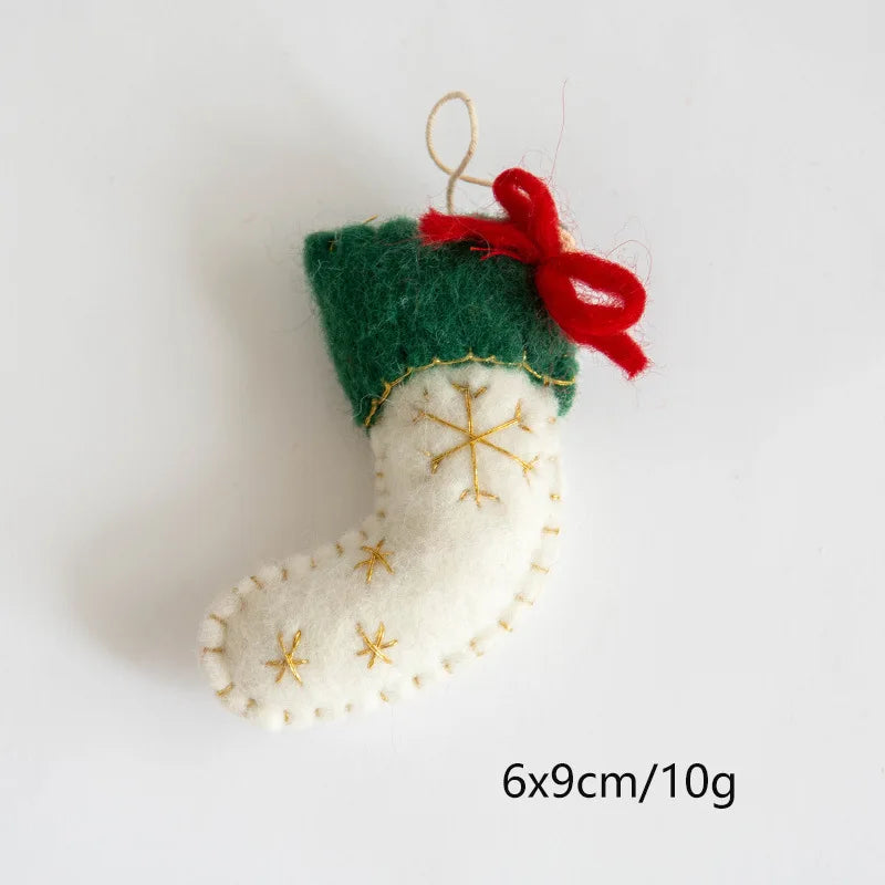 Small felt Christmas stocking ornament with a red bow on a white background